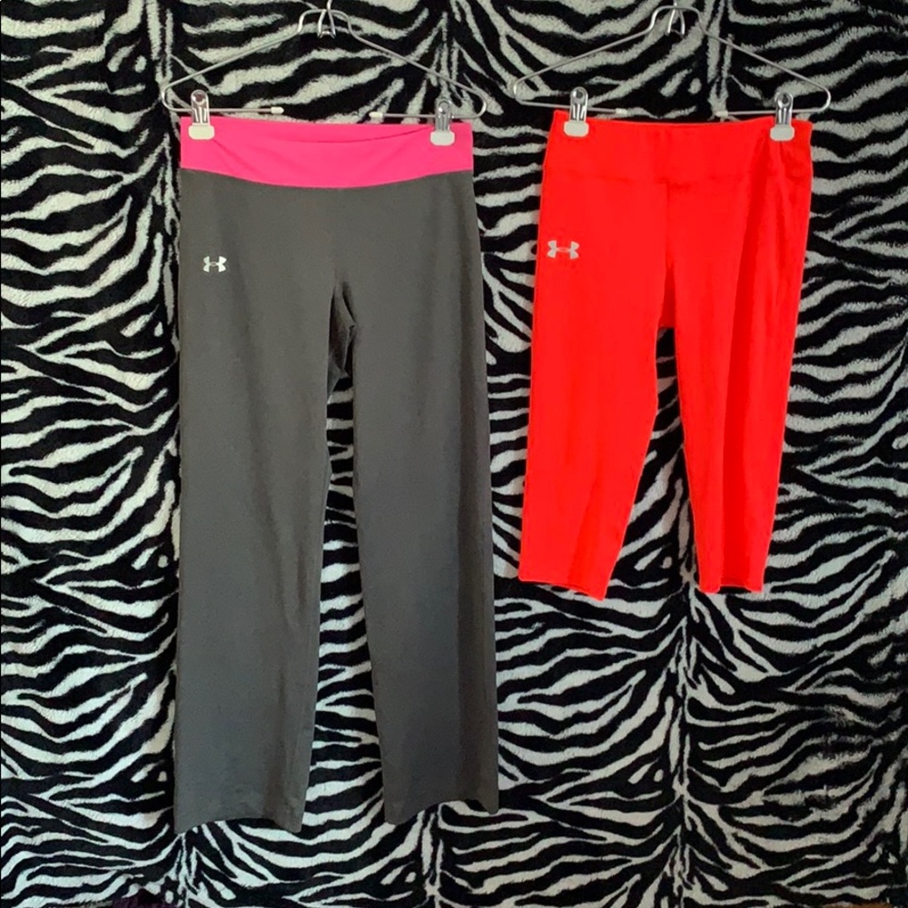 two pairs of under armor leggings